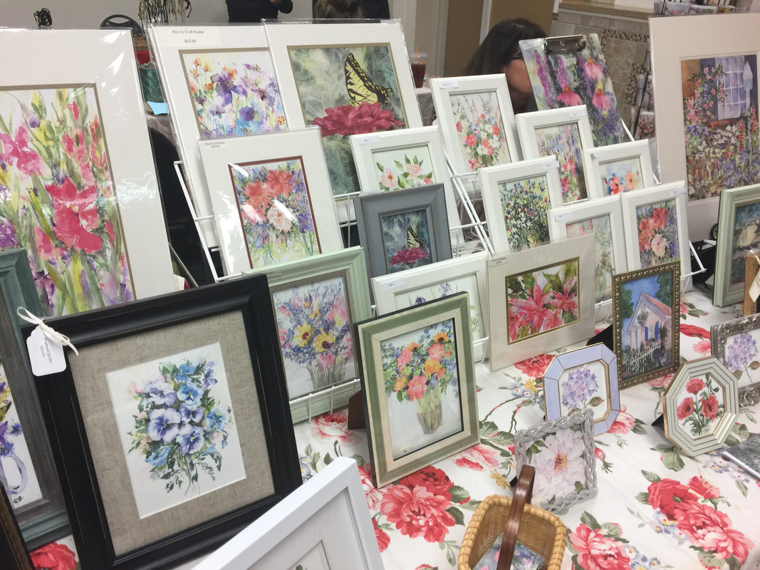 Kelly's Display of Framed Prints at a Show